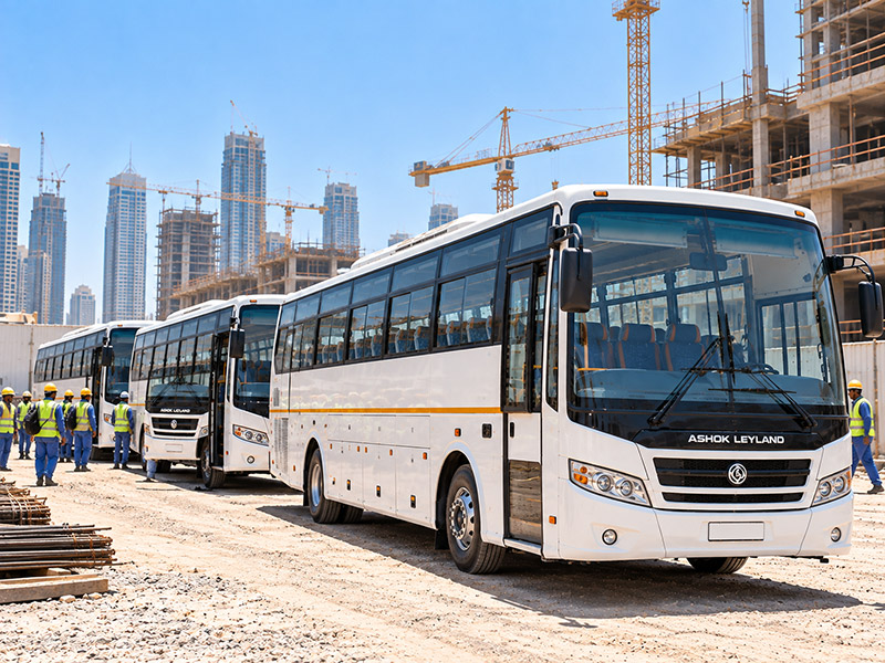 Ashok Leyland 71 seater staff buses at a project site